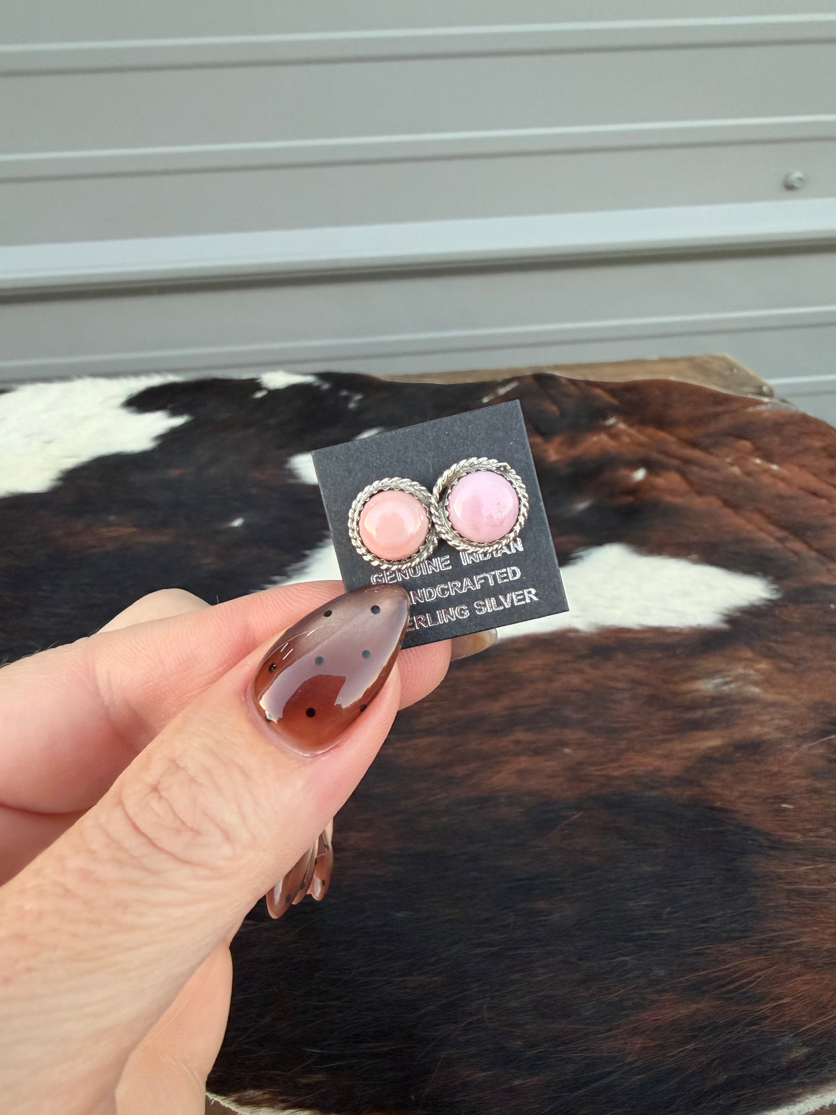 Pink conch studs